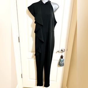 Black Side Ruffle Jumpsuit. Back Invisible Zipper. Size LARGE. Excellent STRETCH